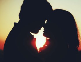 silhouette of a man and woman about to kiss